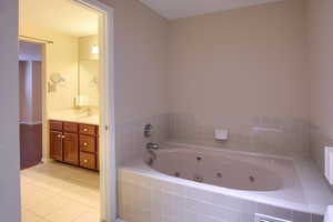 Master bathroom with separate tub and shower.