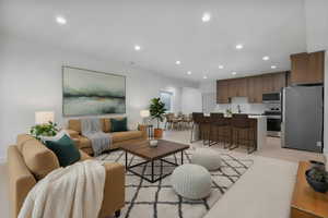 Enhanced staged photo. Basement apartment ADU Living area with recessed lighting
