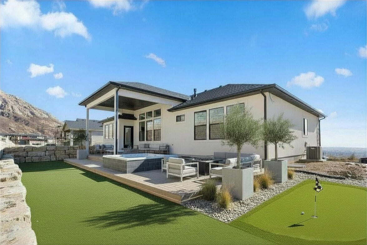 Enhanced photo (Landscape not included) Back of property featuring an outdoor living space, a putting green, a patio area, and a deck with mountain view