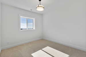 Neutral tone walls and carpeting create a versatile interior