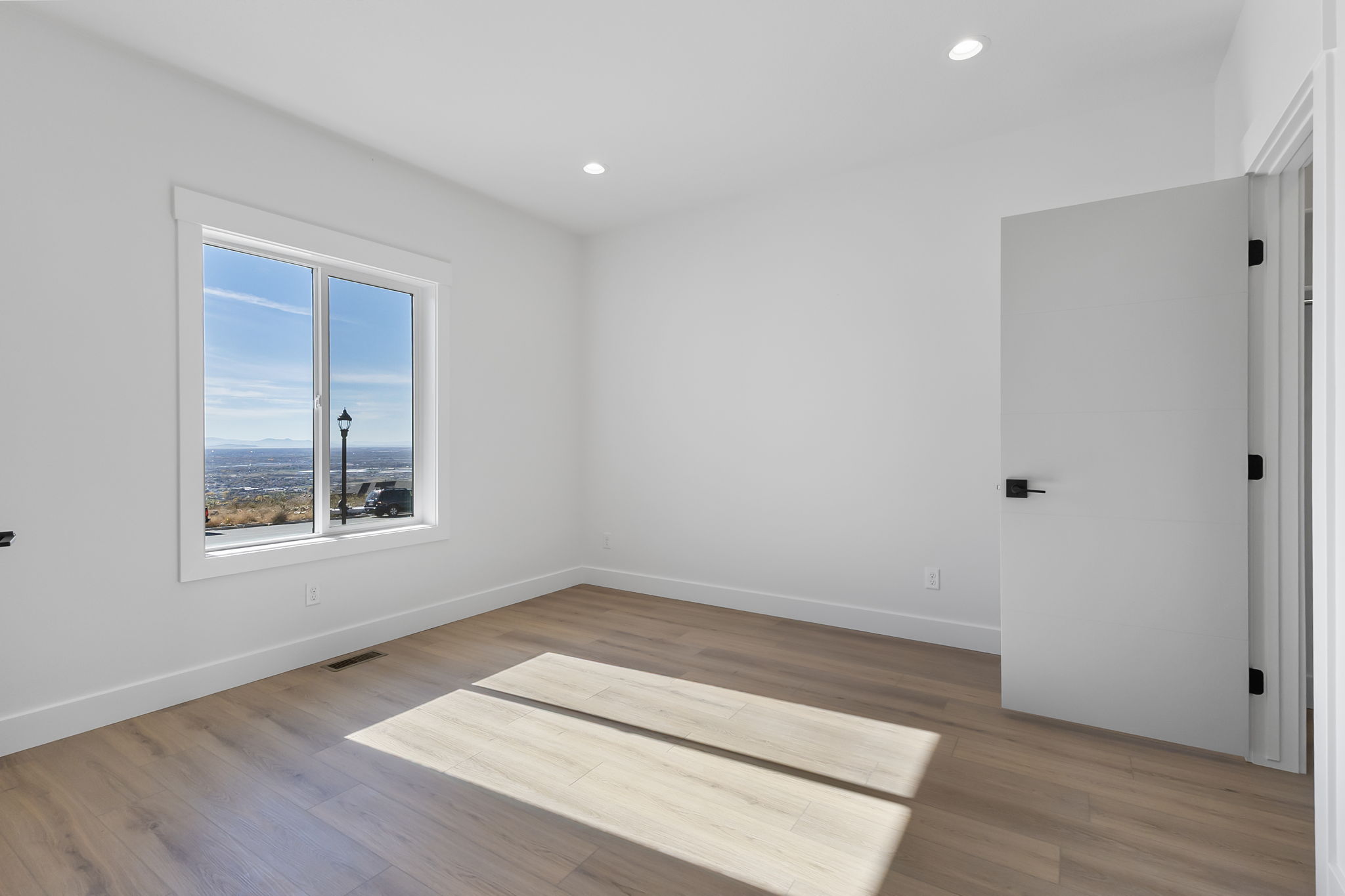 Unfurnished room featuring light wood-type flooring and recessed lighting