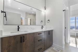 Bathroom with walk in shower and double vanity