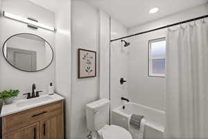 Full bath with vanity and shower / bathtub combination with curtain
