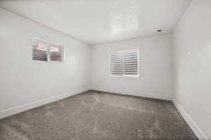 Spare room with carpet flooring and baseboards
