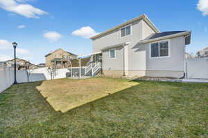 Rear view of property with a fenced backyard, stucco siding, a gate, and a patio