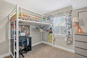 Bedroom with light carpet