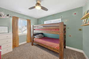 Bedroom with carpet flooring and a ceiling fan