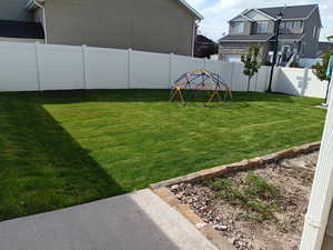 View of fenced backyard