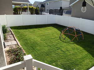 View of fenced backyard
