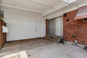 View of exterior entry featuring a patio area