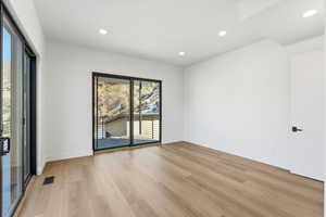 Spare room featuring recessed lighting and light wood-style floors