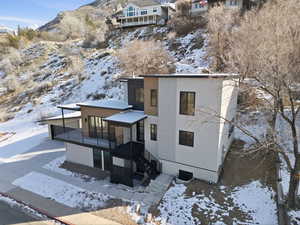 View of front of house with stucco siding and a mountain view