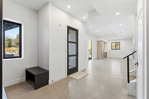 Entryway featuring concrete floors and recessed lighting