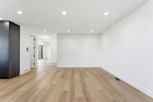 Unfurnished room featuring recessed lighting and light wood-style floors