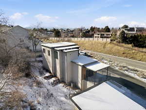 Snow covered structure featuring a residential view