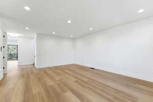 Spare room featuring recessed lighting and light wood-style flooring
