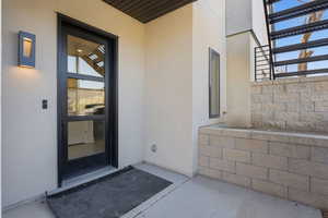 Property entrance with stucco siding