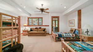 Carpeted bedroom with recessed lighting and ceiling fan