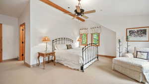 Bedroom featuring carpet floors, lofted ceiling, and ceiling fan