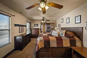 Master Bedroom featuring a ceiling fan and carpet