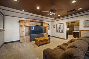 Living area with recessed lighting, a ceiling fan, and light colored carpet