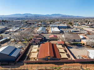 Aerial perspective of suburban area featuring a mountain backdrop