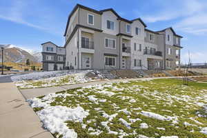 View of front of house featuring a mountain view and stucco siding