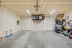 Garage featuring a garage door opener