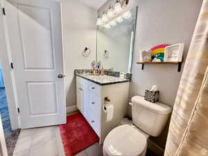Bathroom featuring vanity and light tile patterned flooring