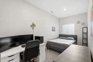 Bedroom featuring new carpet, a desk and recessed lighting