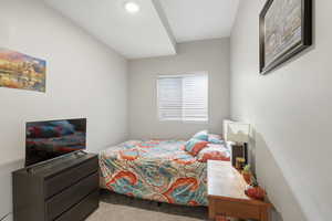 Bedroom featuring new carpet