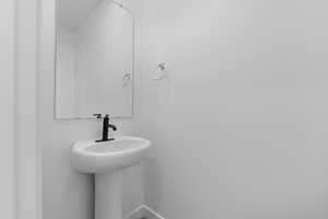 Bathroom featuring baseboards