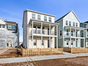 View of front facade featuring board and batten siding and a residential view