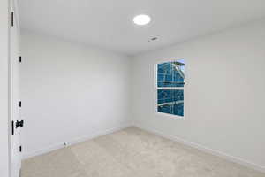 Empty room with baseboards and carpet floors
