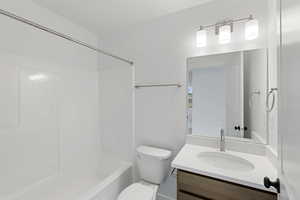 Bathroom featuring vanity and shower / tub combination