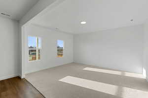Unfurnished room with baseboards and wood finished floors