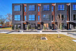 Contemporary home featuring a front lawn