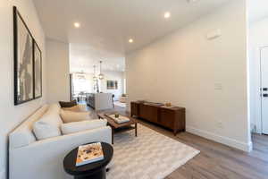 Living area featuring wood finished floors and recessed lighting