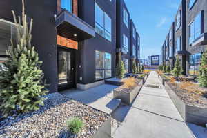 Entrance to property with stucco siding