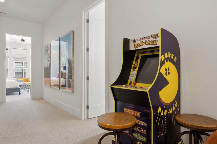Rec room with carpet floors and baseboards