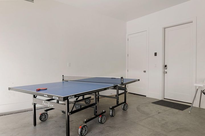 Game room featuring concrete floors