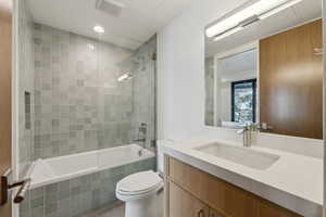 Bathroom featuring vanity and tiled shower / bath combo
