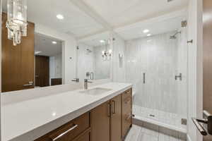 Bathroom featuring vanity, a shower stall, and recessed lighting