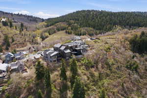 Hillside property featuring multiple residences with modern architectural designs and various rooflines