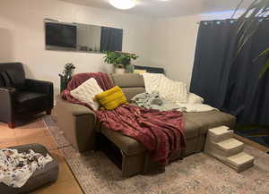 Bedroom with light tile patterned flooring