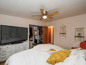 Bedroom featuring a closet and a ceiling fan