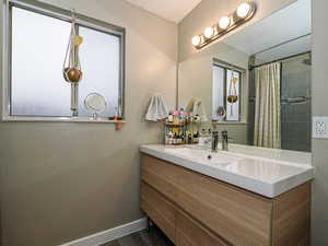 Bathroom with vanity and a shower with curtain