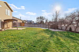Fenced backyard featuring a patio