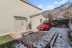 View of home's exterior featuring a fenced backyard and a mountain view