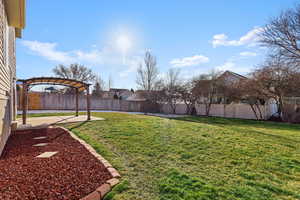 Fenced backyard with a patio